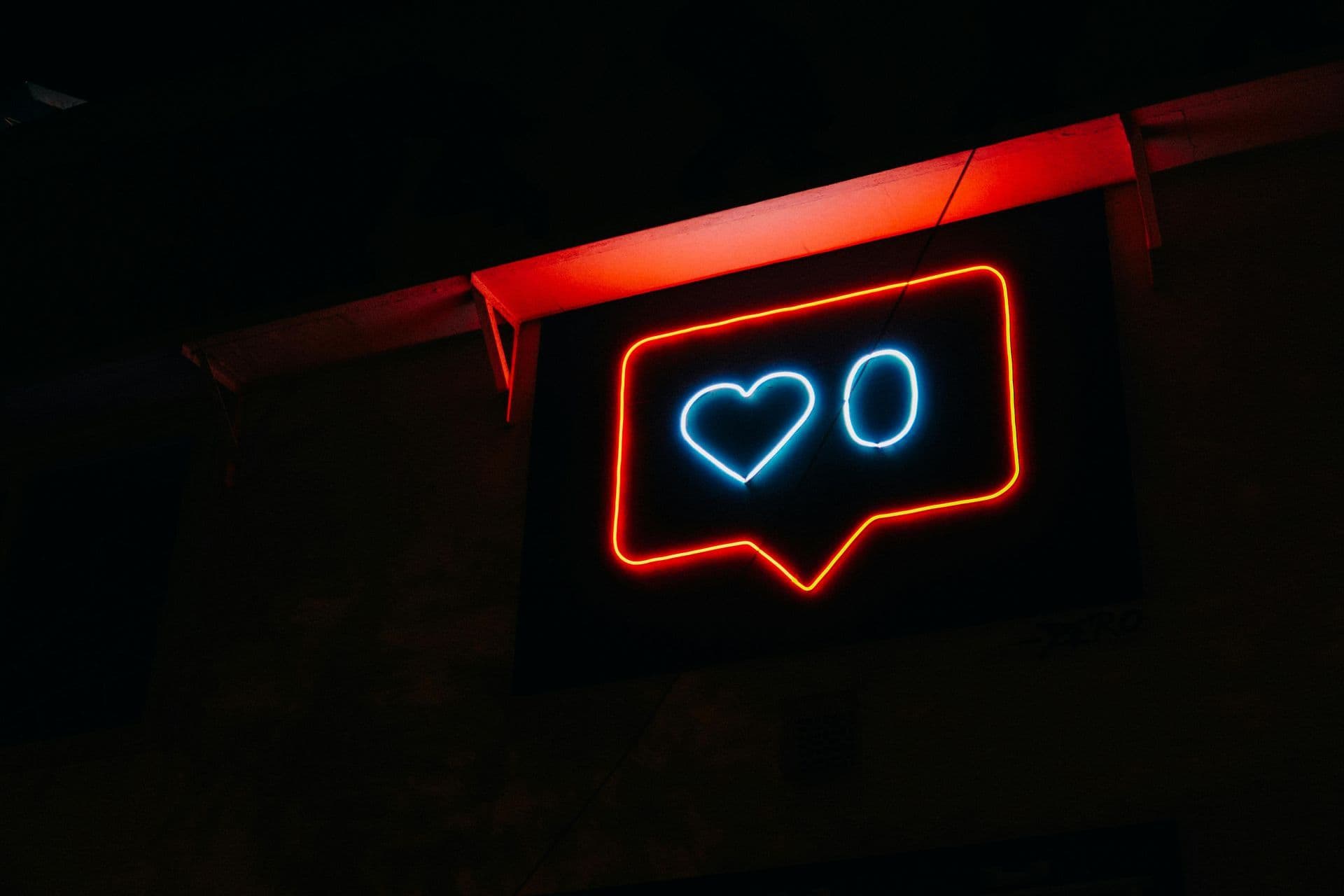 Neon social media icon on a building